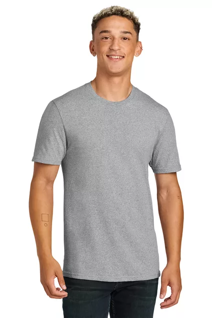 A young man wearing a heather grey customizable t-shirt