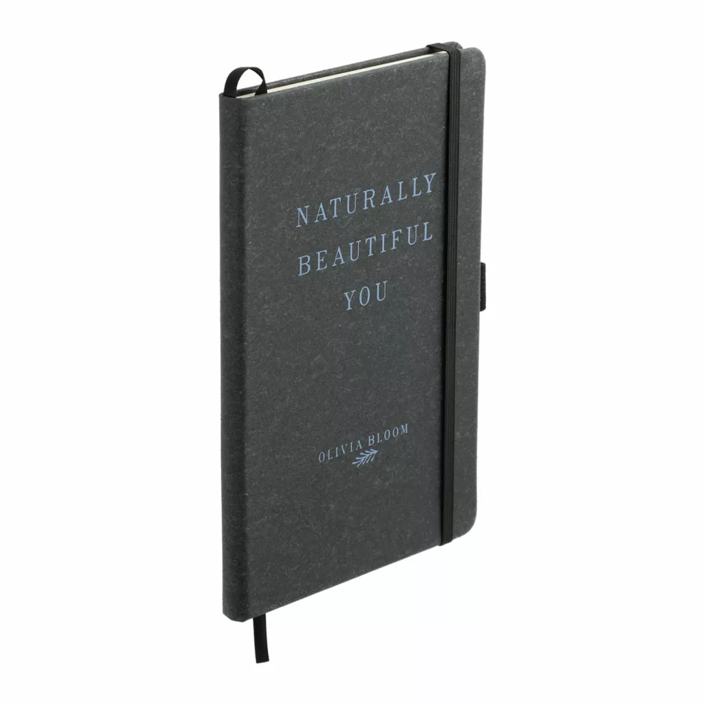 Black leather journal with a custom message "naturally beautiful you"