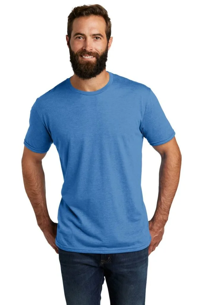 Man wearing blue Allmade tri-blend tee made from recyclables. 