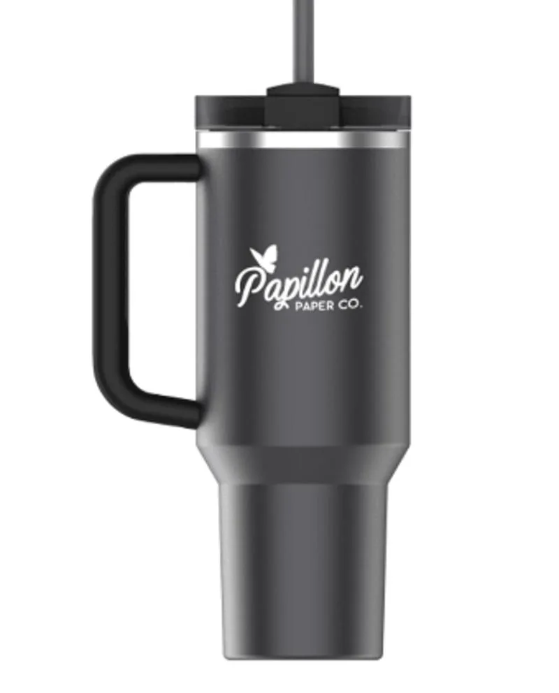 Black Stanley Quencher tumbler with handle and straw on white.