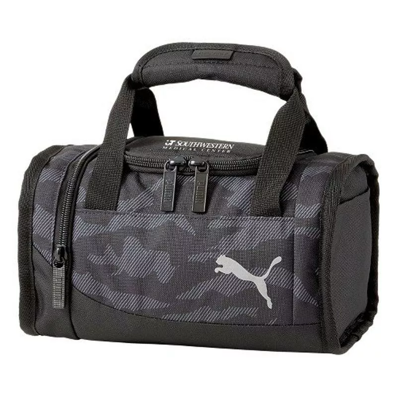 Black camo PUMA cooler bag with zippered compartments and handle.