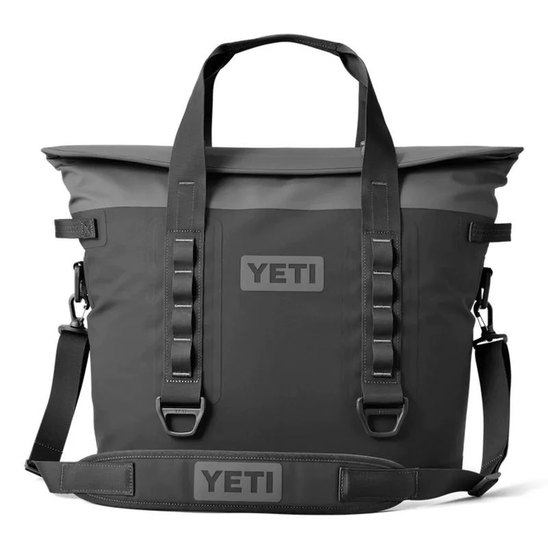 Black YETI Hopper soft cooler with sturdy straps and latches.