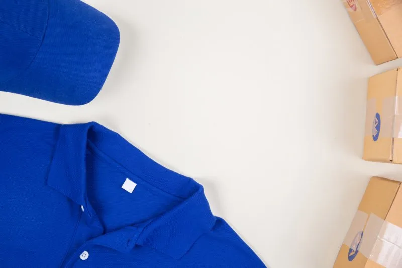 Branded polo shirt and cap folded with custom trade show boxes