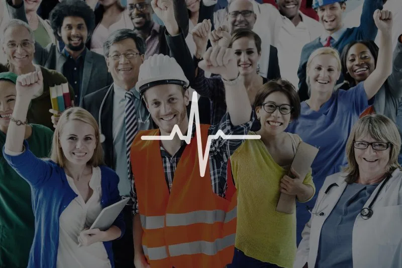 Diverse group of smiling professionals in safety gear celebrating workplace wellness with branded health and safety products.