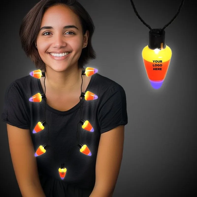 LED candy corn necklace glowing in festive colors, branded Halloween safety accessory for trick-or-treat promotions.