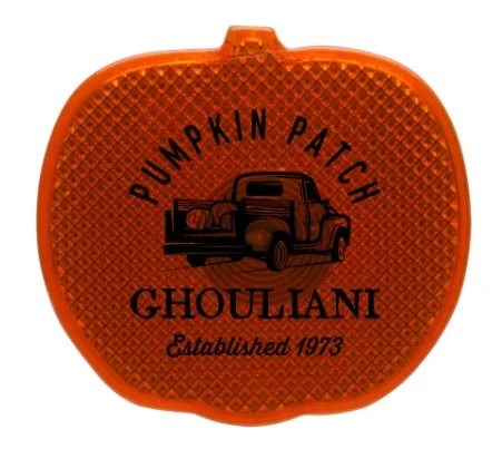 Pumpkin LED strobe safety light with a clip, custom Halloween promotional product promoting brand visibility and safety.
