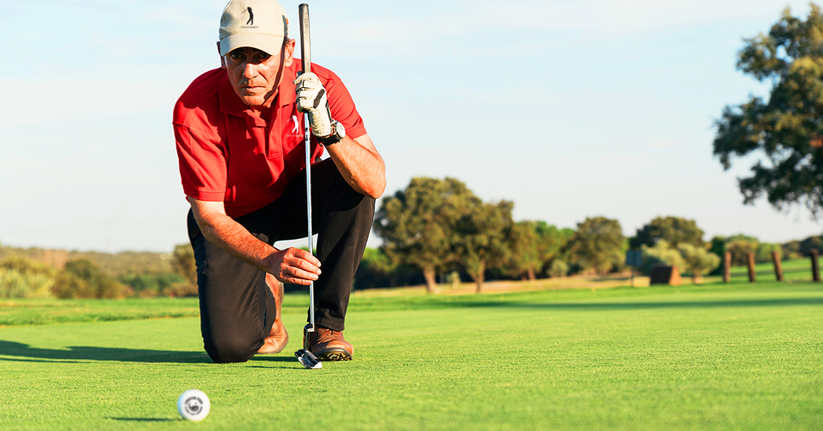 pro golfer aiming to get the golf ball into the hole