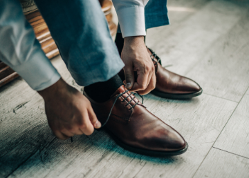 Screen Shot 2019-04-24 at 10.35.28 AM Man tying shoes