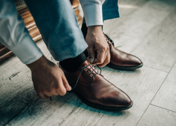 Man tying shoes