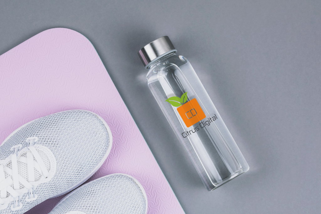 Glass customized water bottle with yoga mat and tennis shoes