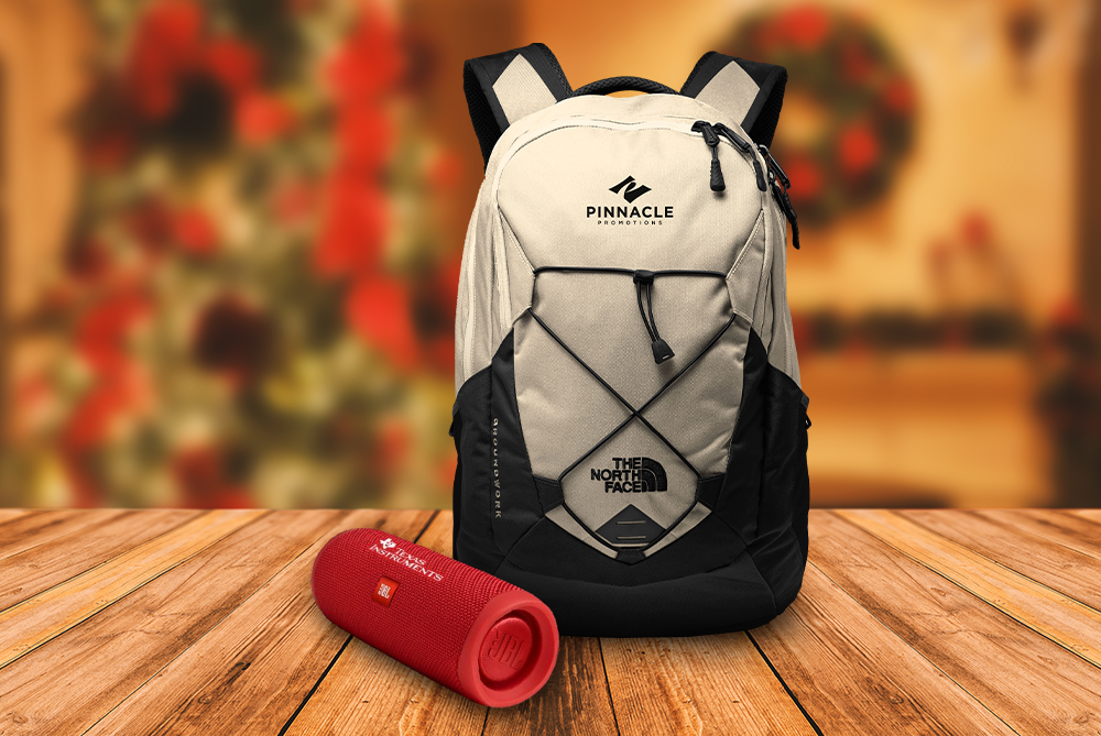 White North Face backpack with red JBL speaker.
