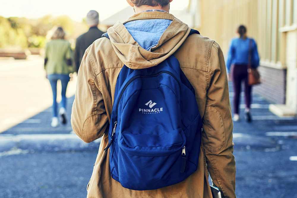 Man wearing blue branded backpack