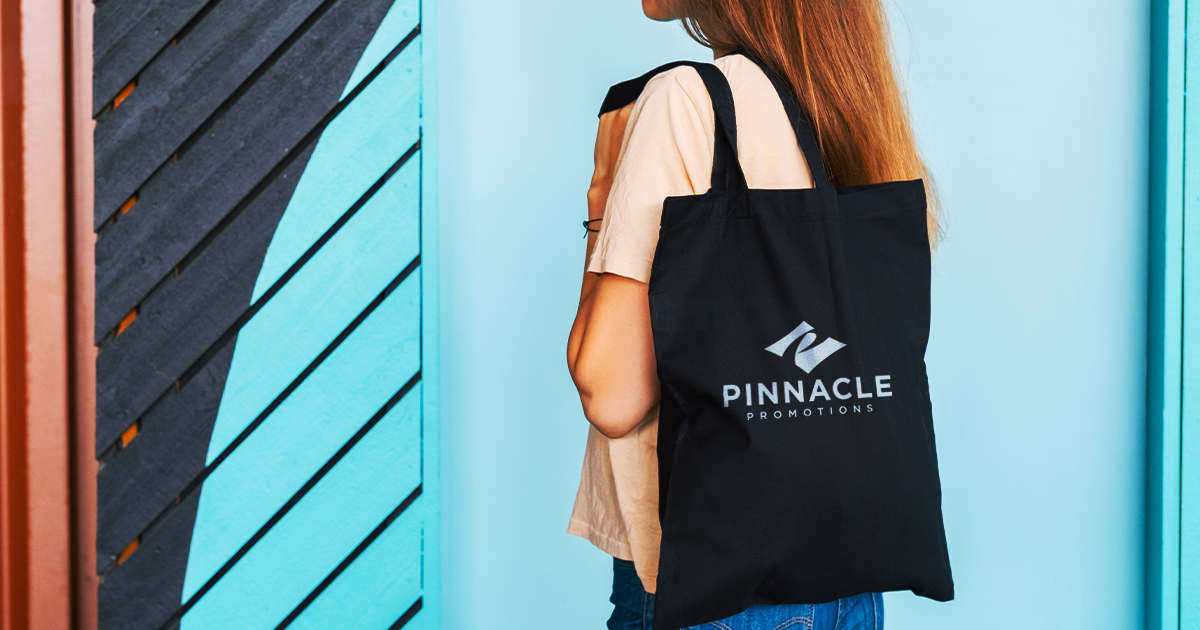 Woman carrying a logo product tote bag