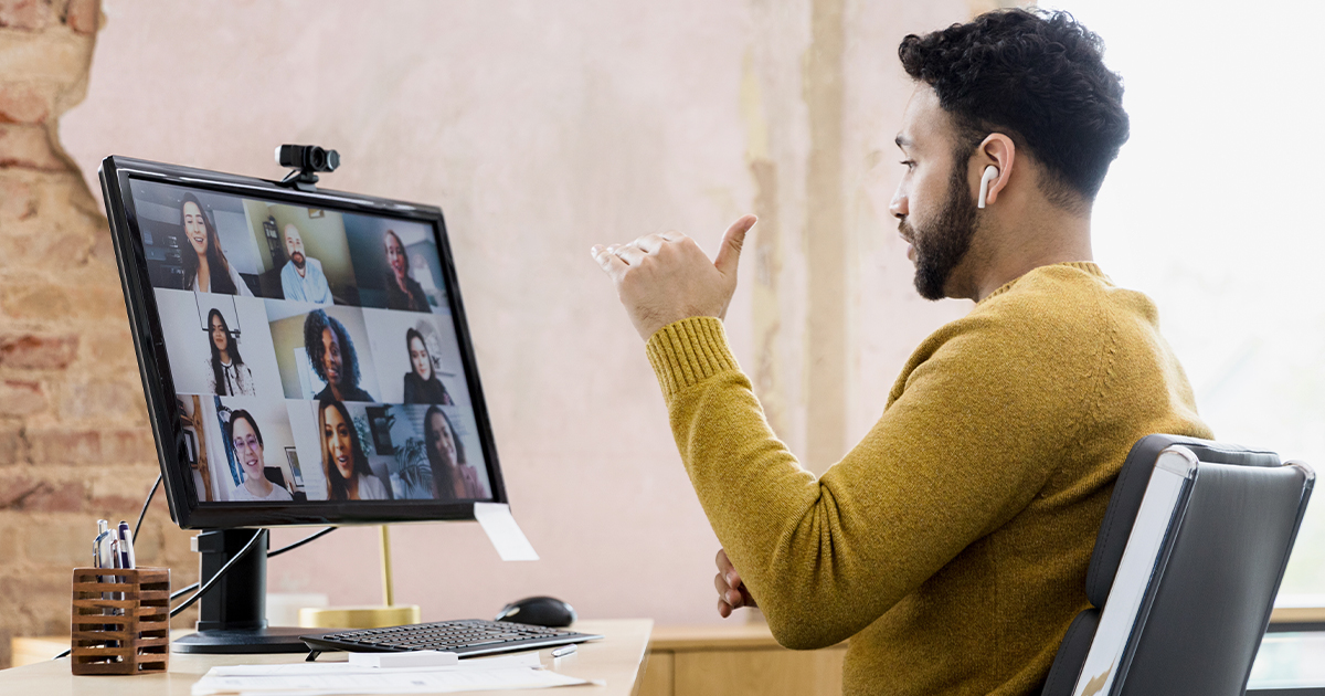 Man on virtual call with work-from-home kit