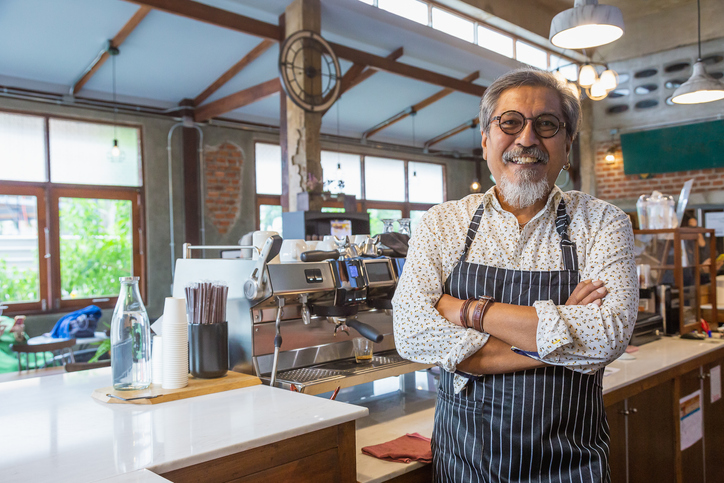 Coffee shop owner in his shop