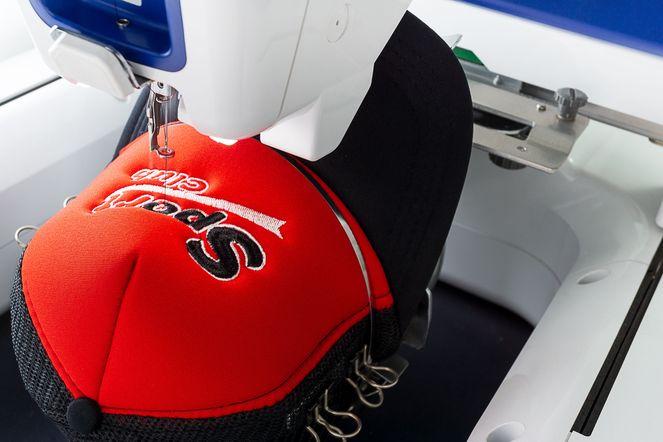 Branded hat being embroidered