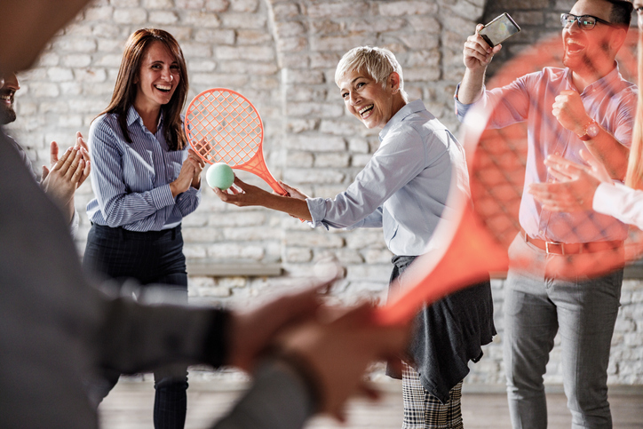 Team playing custom game in office