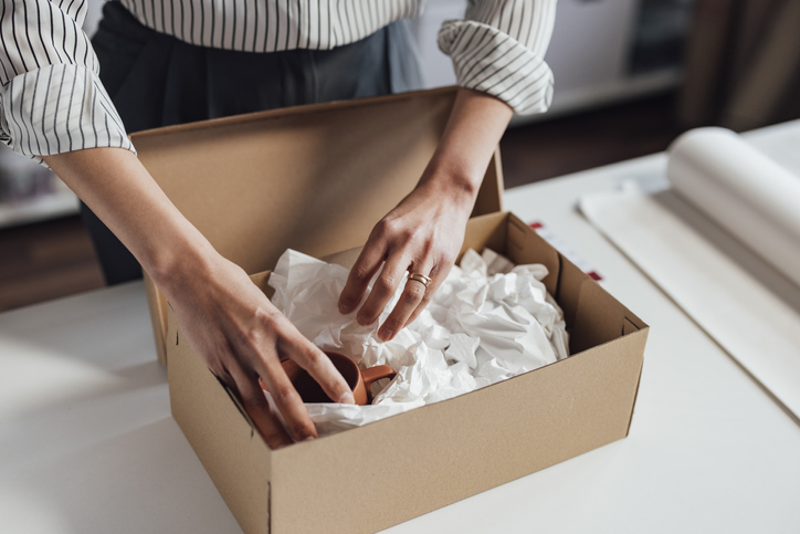 Woman unboxing new promo