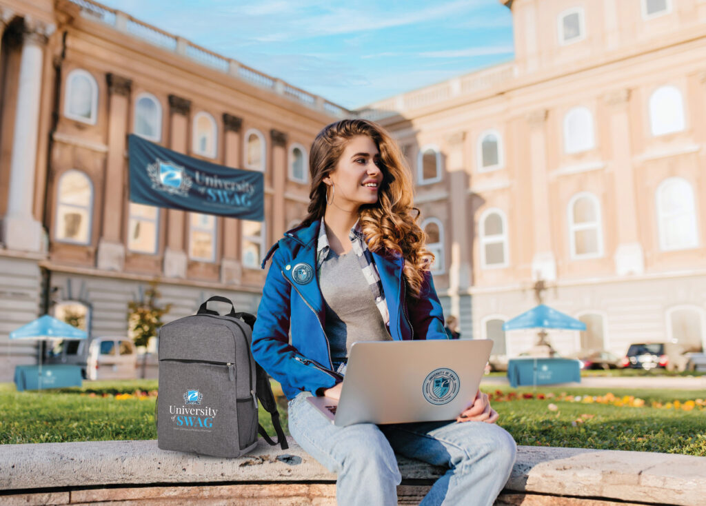 College student with University of Swag branded items.