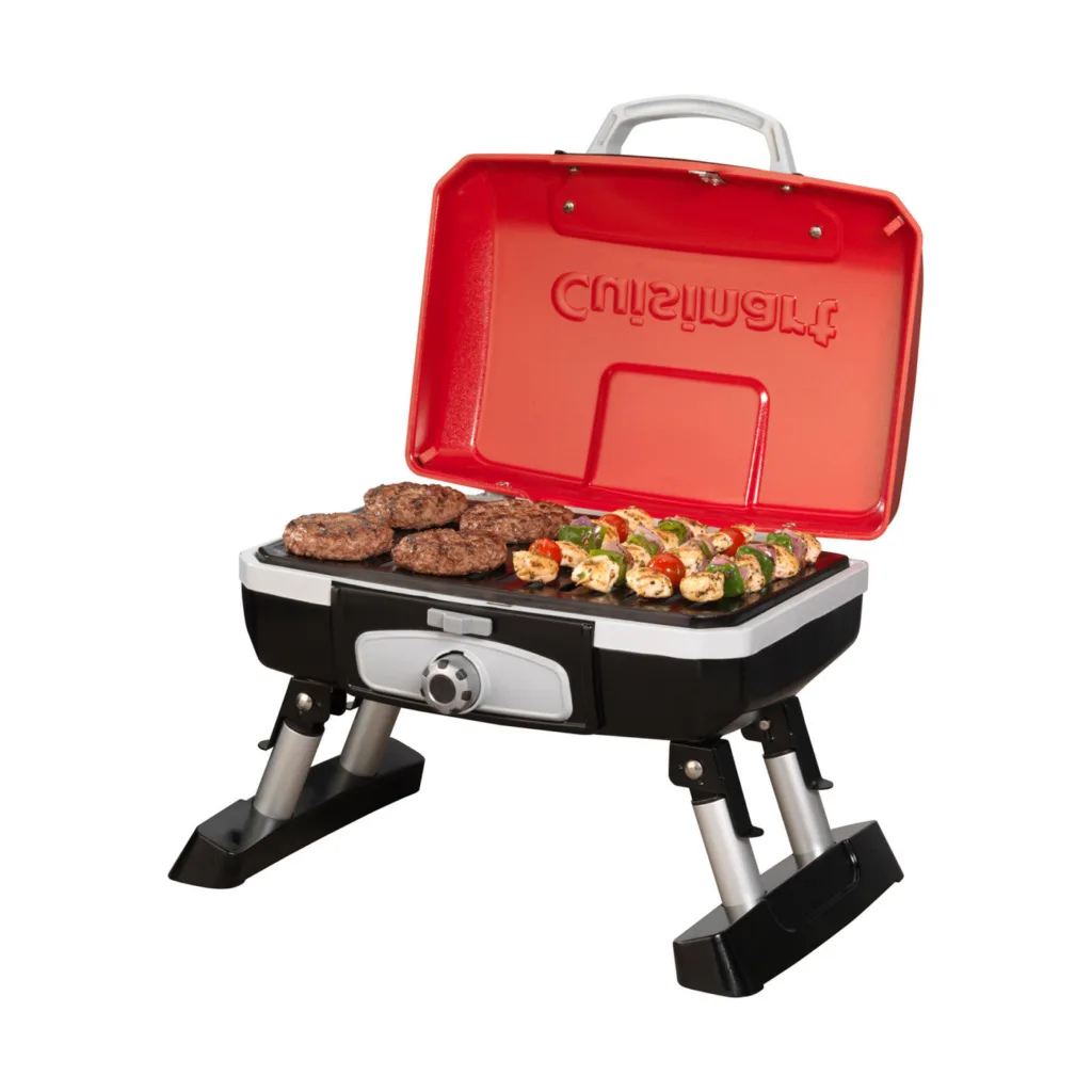 Cuisinart® Petite Gourmet Portable Gas Grill with skewers cooking at tailgate event, customizable for branding.