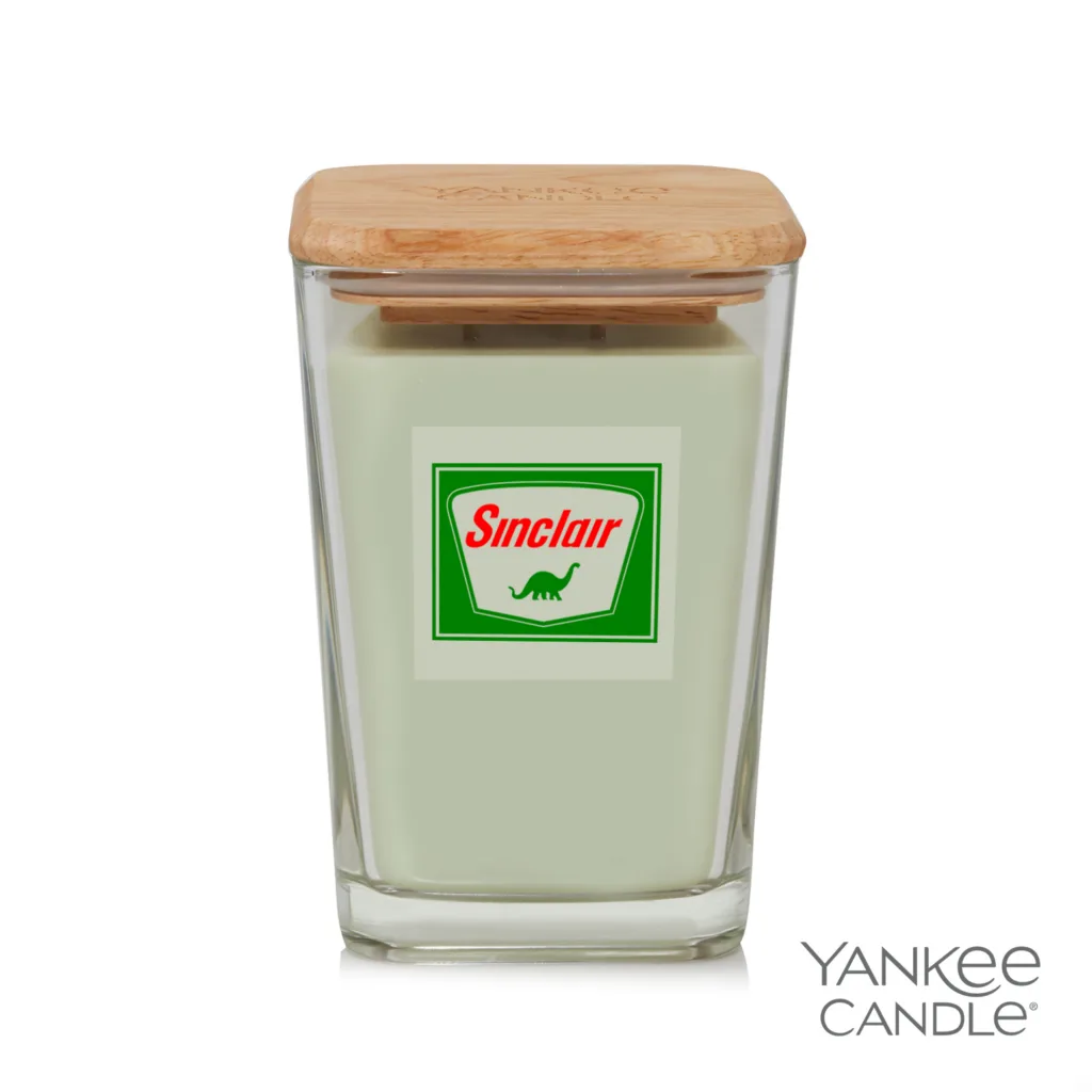 Branded Yankee Candle in green with green and white Sinclair logo
