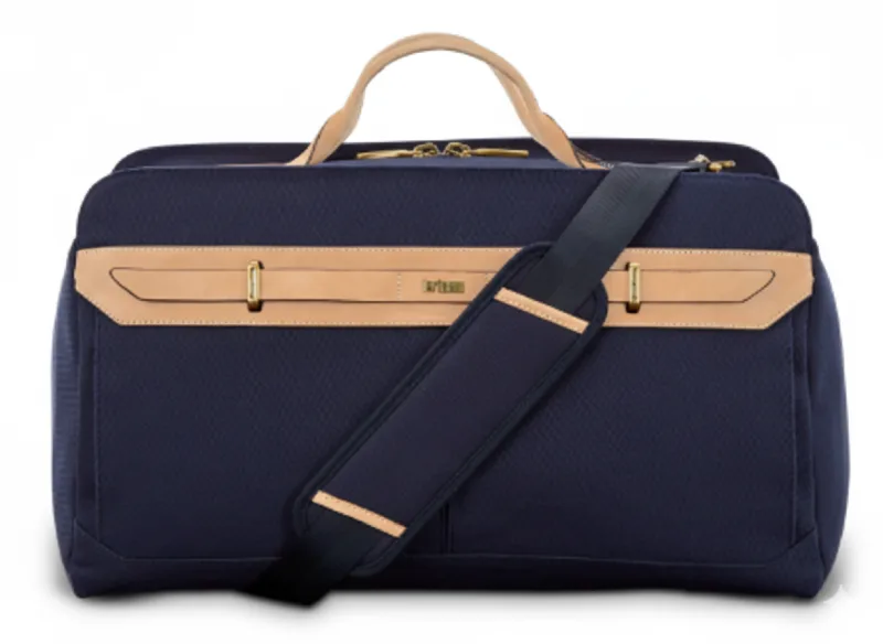 Navy canvas weekender duffel bag with tan leather accents and custom logo embroidery. AI-generated