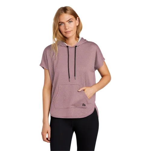 Woman wearing short sleeve pink hoodie with black strings and New Era branding on front pocket.