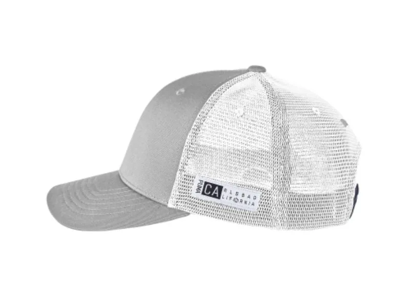 Gray PUMA® Golf trucker cap with white mesh back and side logo patch.
