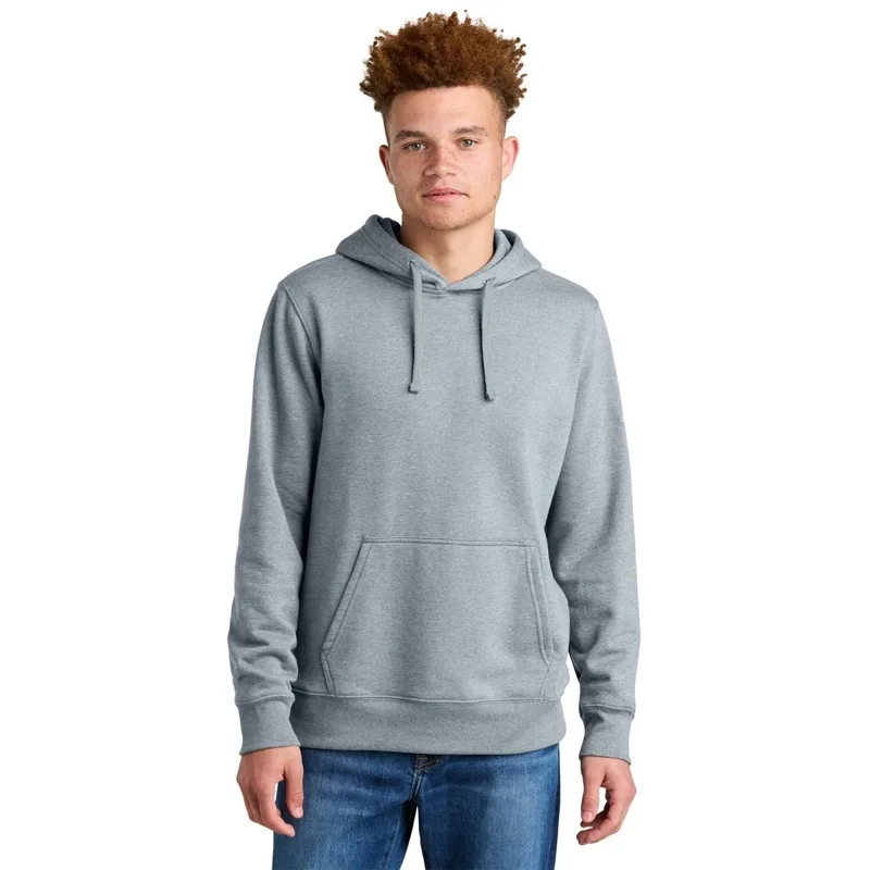 Model wearing a light gray The North Face pullover hoodie with front pocket and drawstring hood.