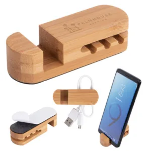 Eco-friendly bamboo desk organizer holding charging cables and smartphone with custom engraving option
