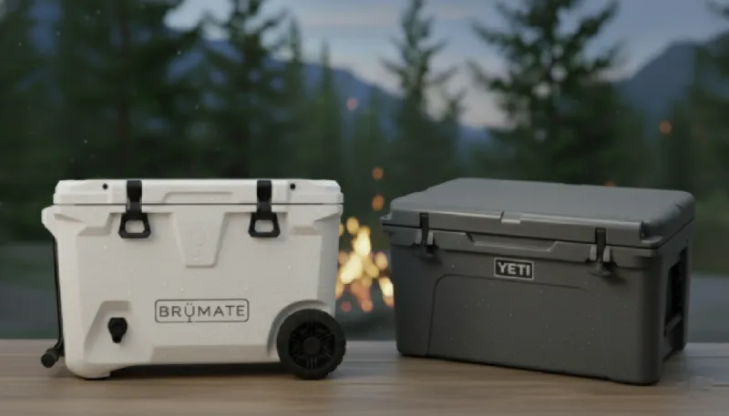 BrüMate white wheeled cooler with black latches beside gray YETI hard cooler comparison