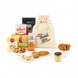 Artisan gourmet snack gift bag with cookies, pretzels, nuts and branded cotton drawstring pouch