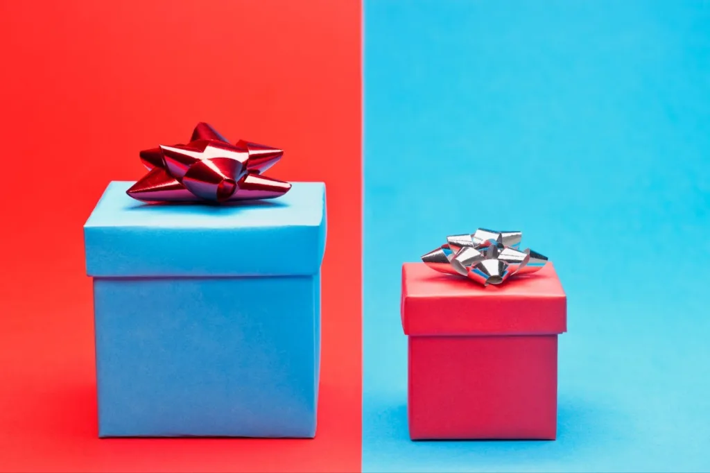 Image of two gifts with red and blue background, wrapped in red and blue wrapping paper.