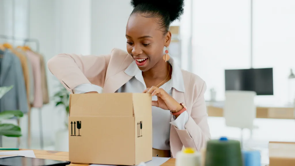Woman opening promotional items for small businesses