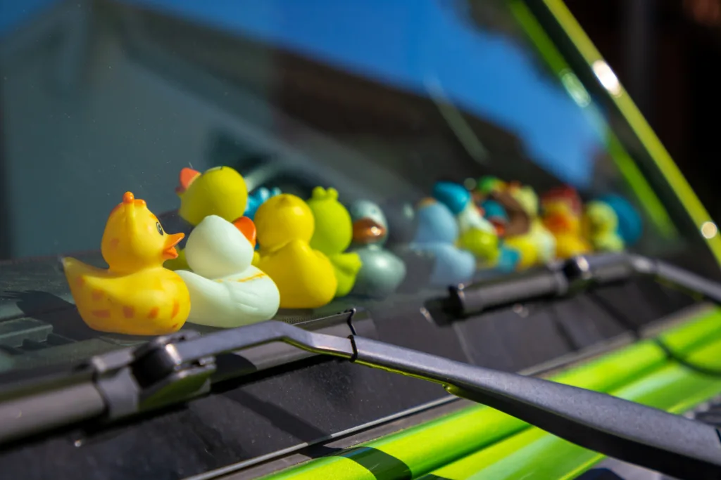 Custom rubber ducks on car dashboard