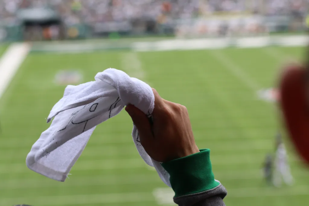 man's hand waving custom rally towel