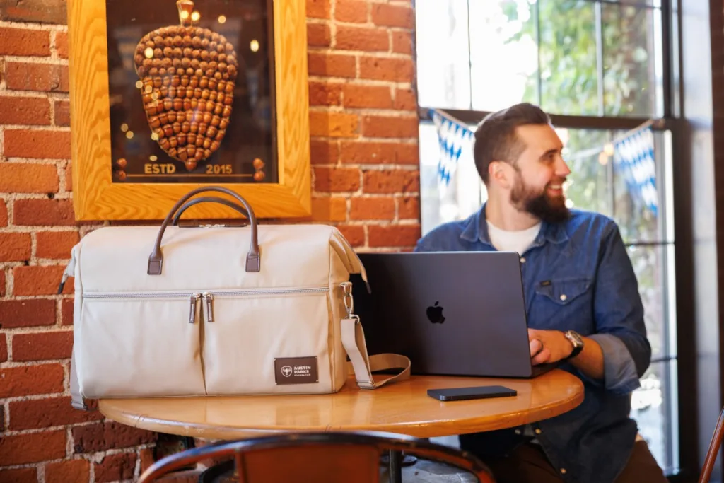 Man with duffel bag given for company milestones gift