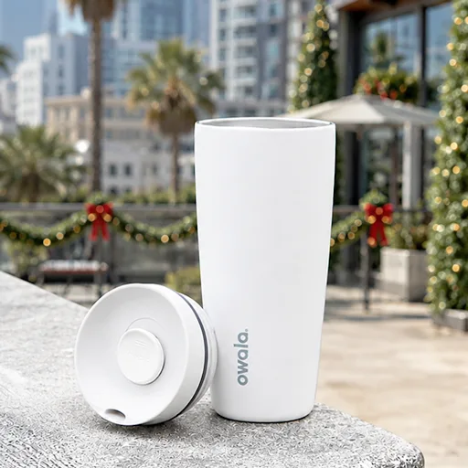 White Owala tumbler with holiday themed background