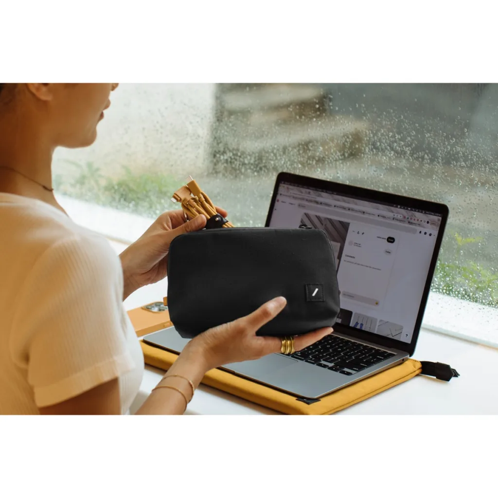 Woman opening new hire swag at desk