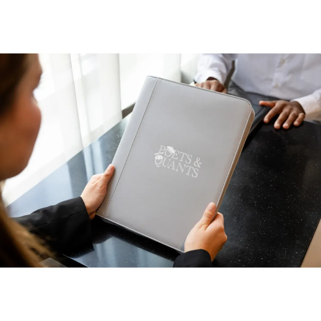 Woman accepting new hire swag branded padfolio