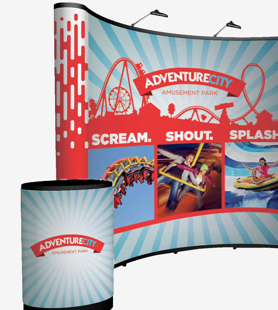 Multi-color display kit for trade shows that includes a table, a backdrop, and lighting