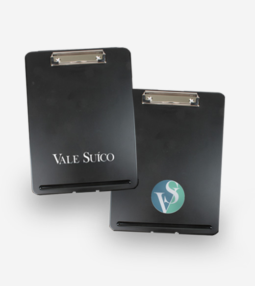 Two black clipboards are positioned diagonally