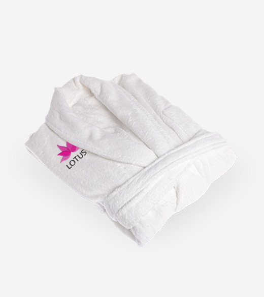 Folded white plush bathrobe featuring a pink flower icon